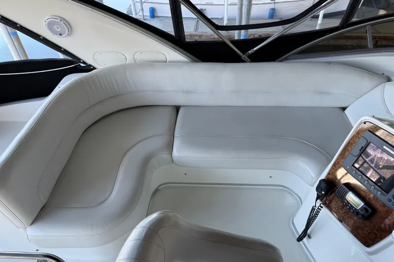  Yacht Photos Pics Interior of a 2005 Meridian 341 Sedan yacht with white leather seating and control panel.