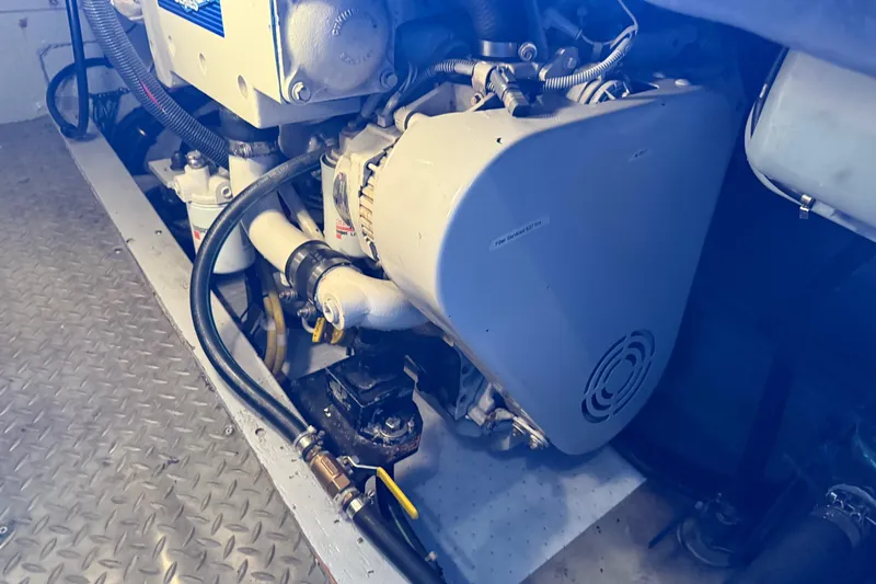  Yacht Photos Pics Engine compartment of a 2005 Meridian 341 Sedan boat, showcasing mechanical components.