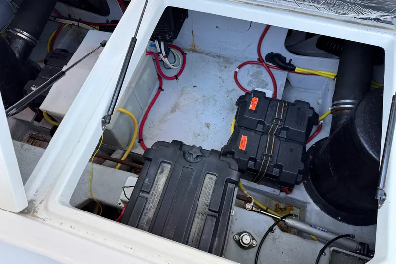  Yacht Photos Pics Engine compartment of a 2005 Meridian 341 Sedan with visible wiring and battery setup.