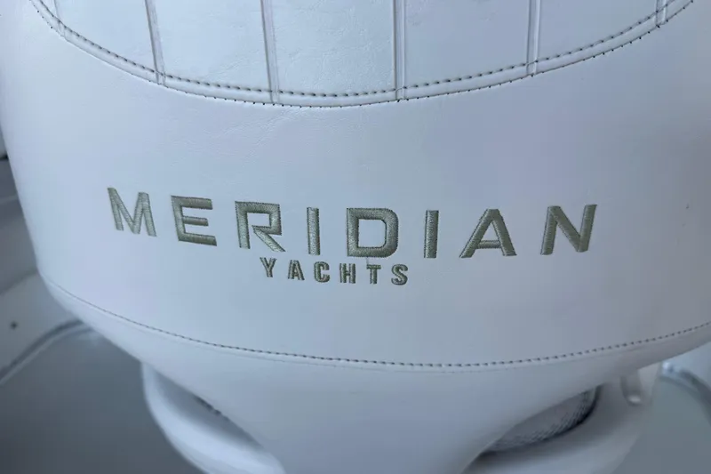 Yacht Photos Pics White leather seat with "Meridian Yachts" logo, 2005 Meridian 341 Sedan.