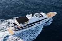 Luxurious 2007 Austal Displacement yacht cruising on open sea with helipad.