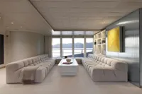 Luxurious yacht interior with plush seating, modern decor, and ocean view. Austal Displacement, 2007.