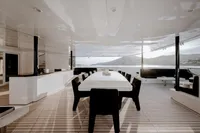 Luxurious Austal Displacement yacht interior, 2007 model, featuring elegant dining area with ocean view.
