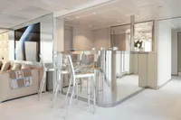 Luxurious yacht interior with modern bar, sleek metallic finishes, and elegant seating. Austal Displacement 2007.