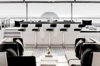 Luxurious yacht deck with bar stools and elegant seating, Austal Displacement 2007 model.