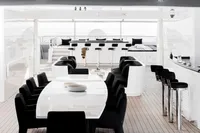 Luxurious yacht interior with modern dining and bar area, Austal Displacement 2007.