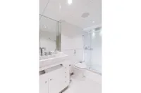 Luxurious yacht bathroom with modern fixtures, glass shower, and marble countertop, Austal Displacement 2007.