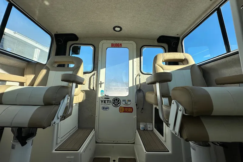 Fortuna Yacht Photos Pics Interior of 2019 Parker 2820 XLD Sport Cabin with beige seating and window views.