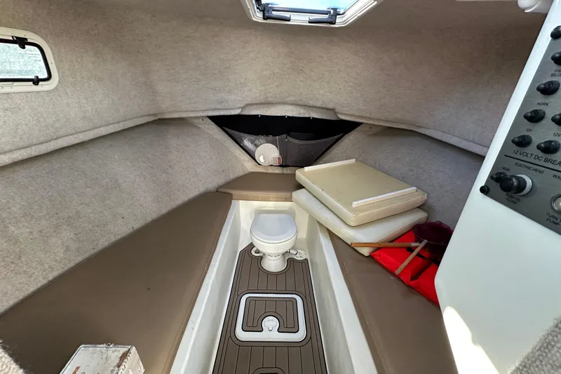 Fortuna Yacht Photos Pics 2019 Parker 2820 XLD Sport Cabin interior with toilet and control panel.