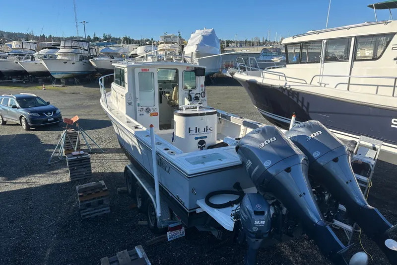 Fortuna Yacht Photos Pics 2019 Parker 2820 XLD Sport Cabin boat with dual engines in a marina.