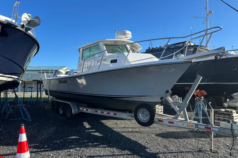 Fortuna Yacht Photos Pics 2019 Parker 2820 XLD Sport Cabin boat on trailer in marina.