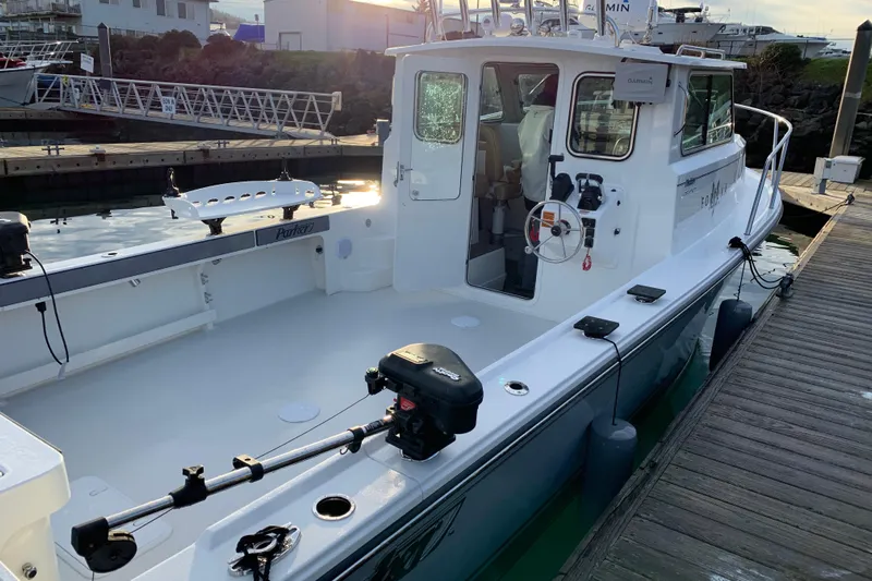 Fortuna Yacht Photos Pics 2019 Parker 2820 XLD Sport Cabin boat docked at marina, side view.