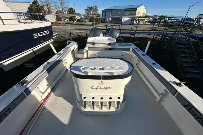 Fortuna Yacht Photos Pics 2019 Parker 2820 XLD Sport Cabin boat deck with fishing equipment.