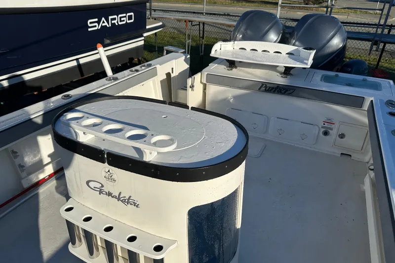 Fortuna Yacht Photos Pics 2019 Parker 2820 XLD Sport Cabin boat interior with fishing rod holders.
