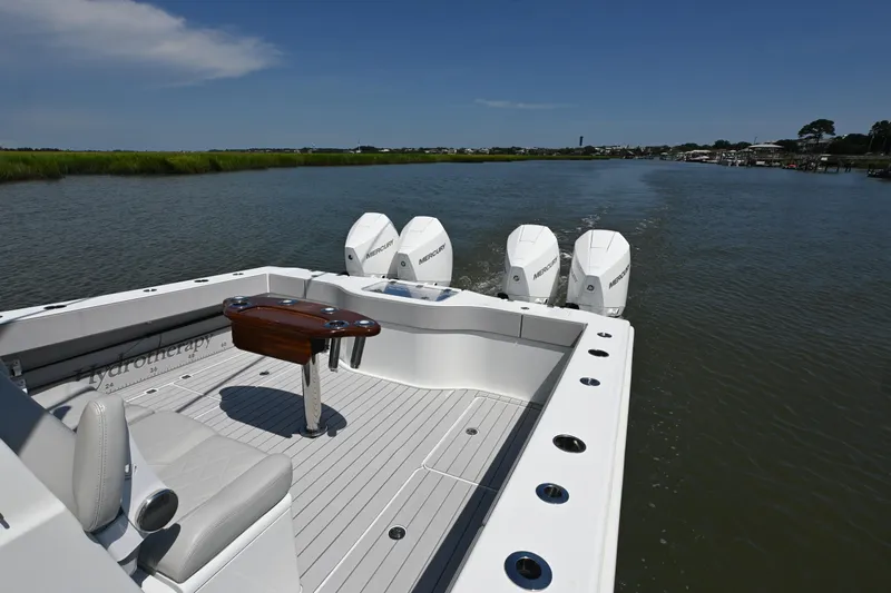  Yacht Photos Pics Freeman 37VH 2021 boat with Mercury engines cruising on a calm river.