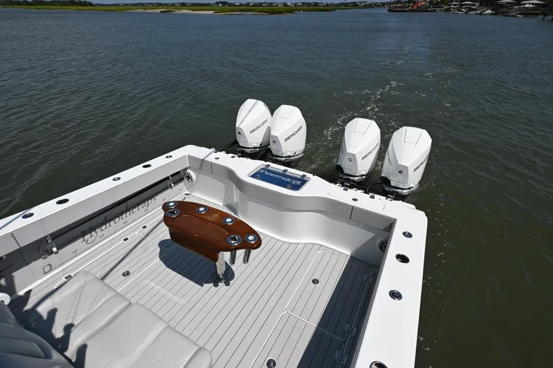  Yacht Photos Pics Freeman 37VH 2021 boat with four Mercury outboard engines on a calm waterway.