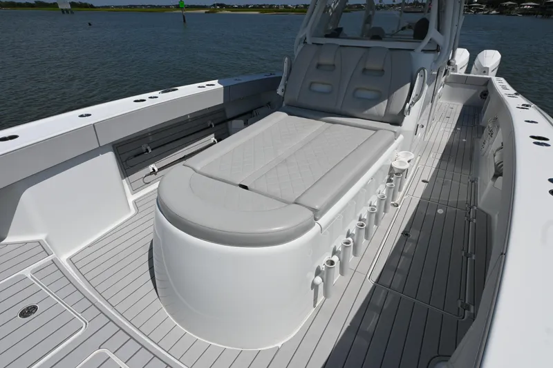  Yacht Photos Pics Freeman 37VH 2021 boat interior with cushioned seating and rod holders on deck.