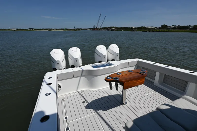  Yacht Photos Pics Freeman 37VH 2021 boat with four Mercury engines on a calm waterway.