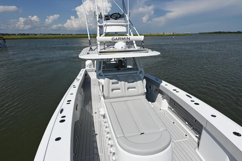  Yacht Photos Pics 2021 Freeman 37VH boat on calm water, featuring spacious deck and Garmin equipment.