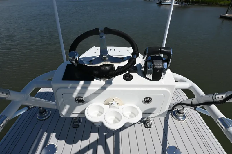  Yacht Photos Pics Helm of 2021 Freeman 37VH boat with steering wheel and controls on deck.