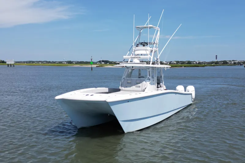  Yacht Photos Pics 2021 Freeman 37VH boat on calm water under clear blue sky.