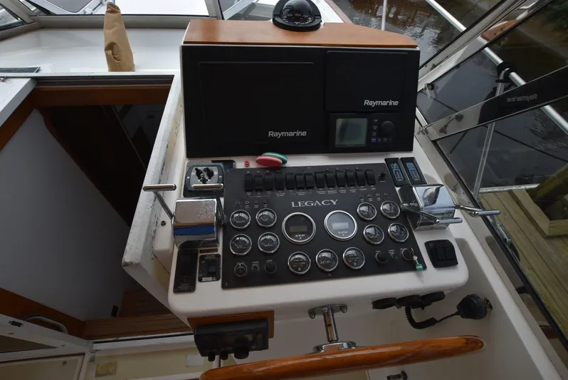 Don't Blink Yacht Photos Pics 1999 Legacy 34 Express boat dashboard with Raymarine navigation equipment.