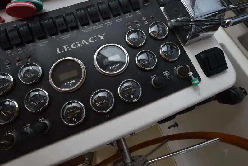 Don't Blink Yacht Photos Pics Control panel of a 1999 Legacy 34 Express boat with gauges and switches.