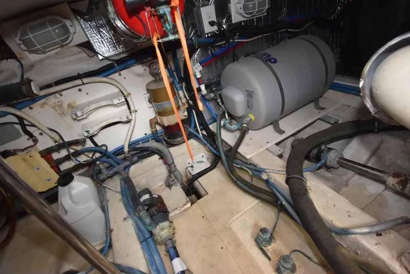 Don't Blink Yacht Photos Pics Engine room of 1999 Legacy 34 Express boat with various mechanical components.