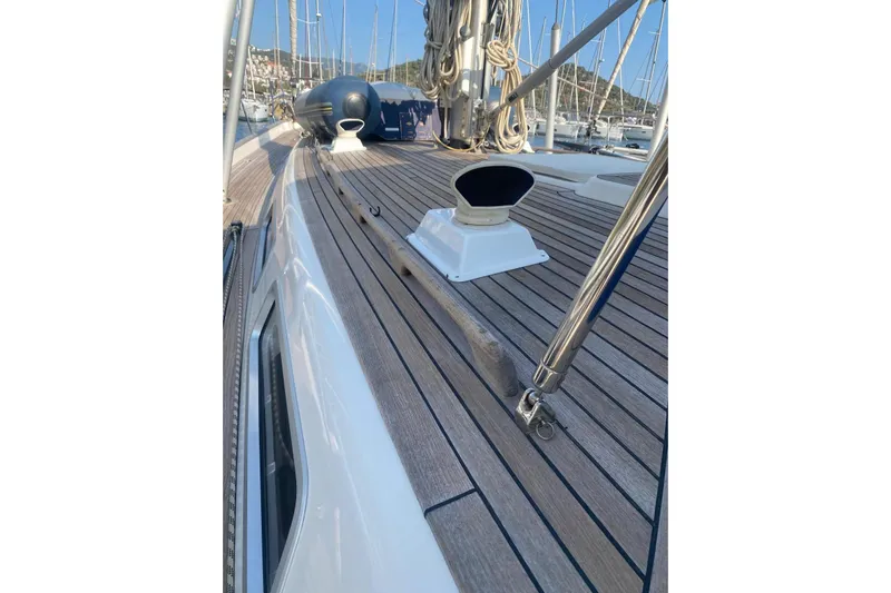  Yacht Photos Pics Deck view of 2007 Hallberg-Rassy 54 sailboat in marina setting.