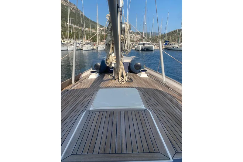  Yacht Photos Pics Deck view of 2007 Hallberg-Rassy 54 sailboat in a marina setting.