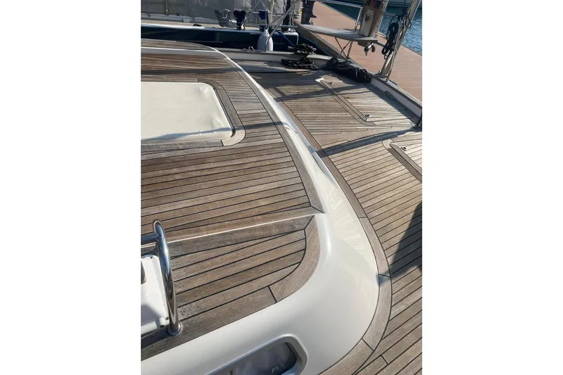  Yacht Photos Pics Teak deck of 2007 Hallberg-Rassy 54 yacht, showcasing elegant wood finish.