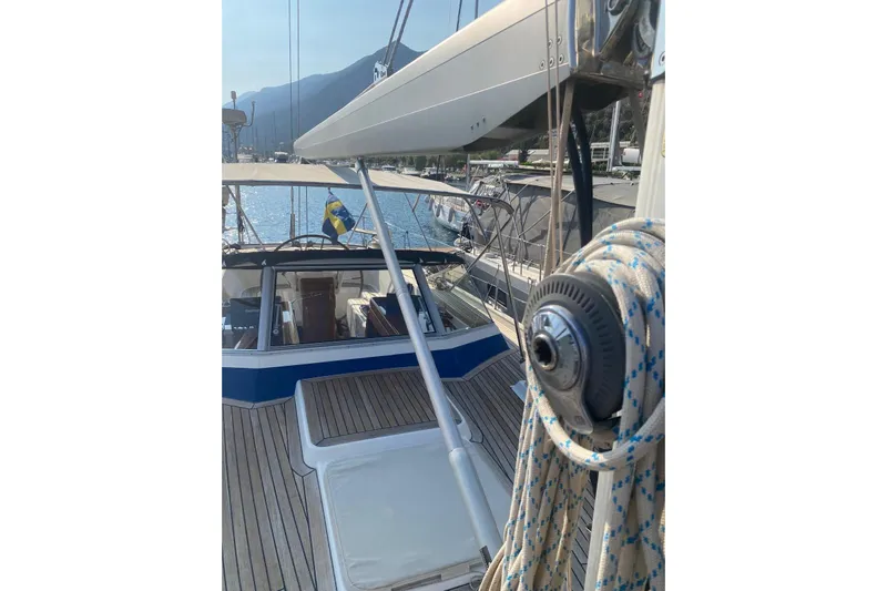  Yacht Photos Pics 2007 Hallberg-Rassy 54 yacht deck with rigging and scenic marina view.