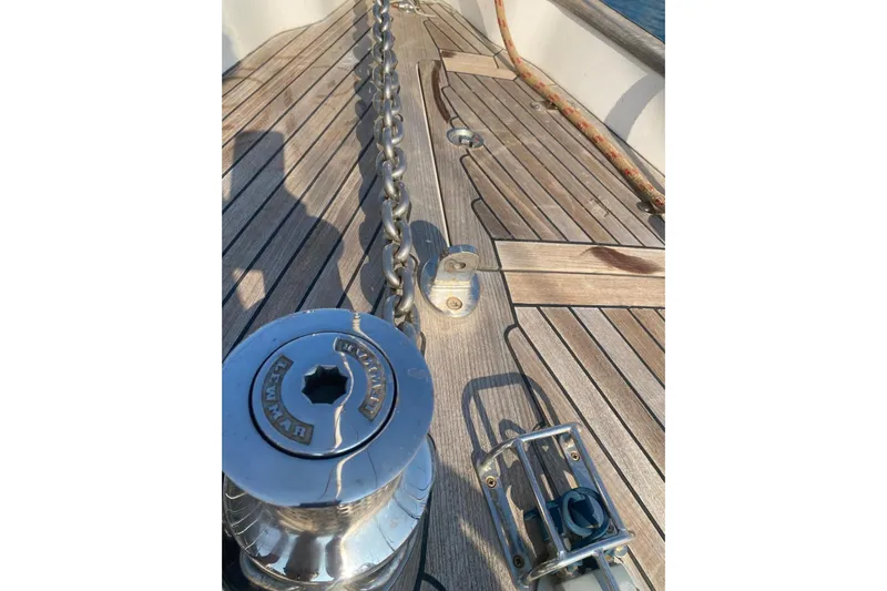  Yacht Photos Pics Deck of 2007 Hallberg-Rassy 54 yacht with anchor chain and winch.
