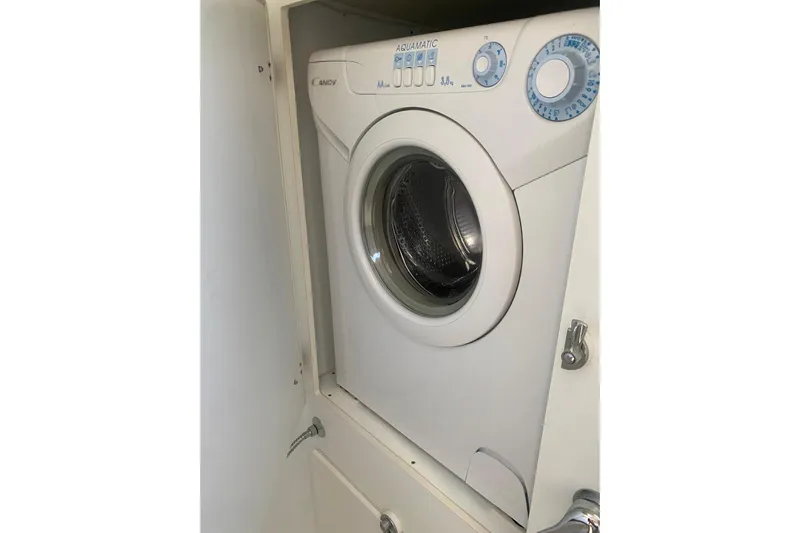  Yacht Photos Pics Washing machine inside Hallberg-Rassy 54 yacht, 2007 model, compact and efficient design.