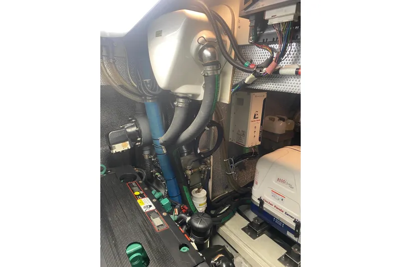  Yacht Photos Pics Engine room of 2007 Hallberg-Rassy 54 yacht, featuring mechanical components and wiring.