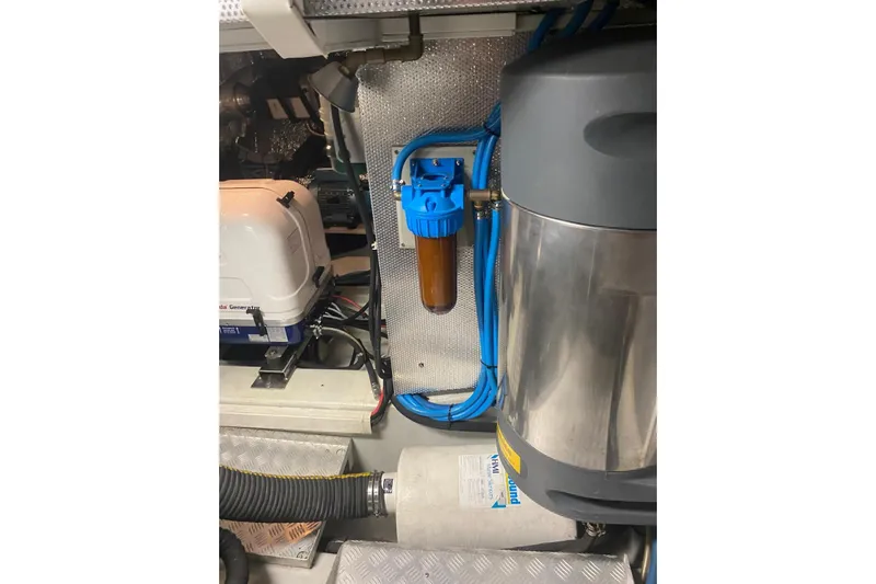  Yacht Photos Pics Engine room of a 2007 Hallberg-Rassy 54 yacht with filtration system and generator.