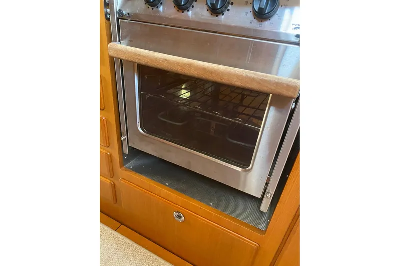  Yacht Photos Pics Stainless steel oven in 2007 Hallberg-Rassy 54 yacht kitchen with wooden cabinetry.