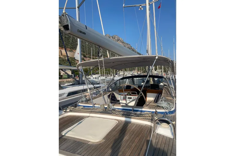  Yacht Photos Pics 2007 Hallberg-Rassy 54 sailboat with spacious deck and cockpit, docked in marina.