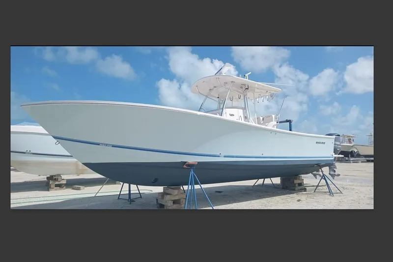  Yacht Photos Pics 2013 Regulator 34SS boat on stands under a clear blue sky.