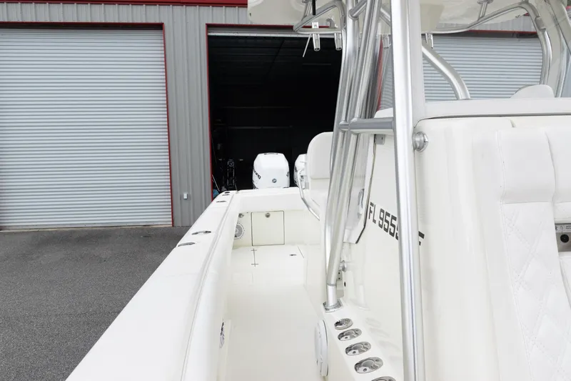  Yacht Photos Pics 2017 SeaVee 340Z boat with white interior, docked near a storage facility.