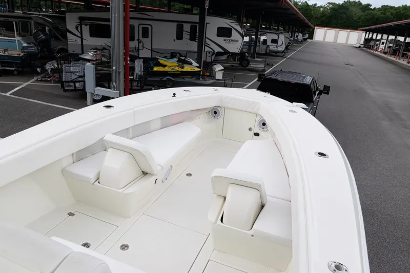 Yacht Photos Pics 2017 SeaVee 340Z boat interior with white seating, parked near RVs and trailers.