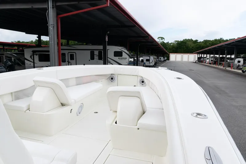  Yacht Photos Pics 2017 SeaVee 340Z boat interior with white seating, parked near RVs.