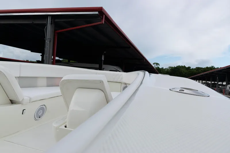  Yacht Photos Pics 2017 SeaVee 340Z boat interior with white seating and speaker, docked under shelter.