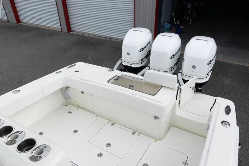  Yacht Photos Pics 2017 SeaVee 340Z boat with triple outboard engines, spacious deck, and storage compartments.