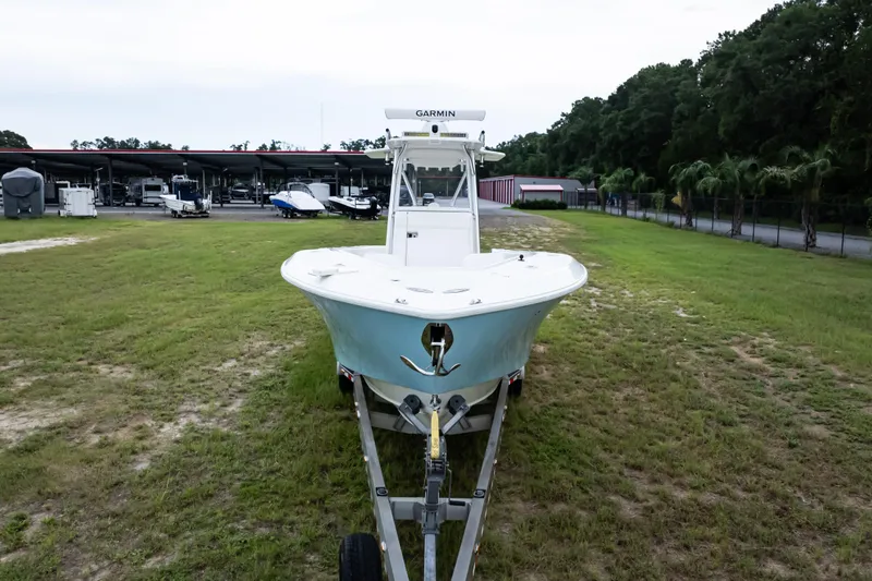  Yacht Photos Pics 2017 SeaVee 340Z boat on trailer, parked on grassy area near storage facility.