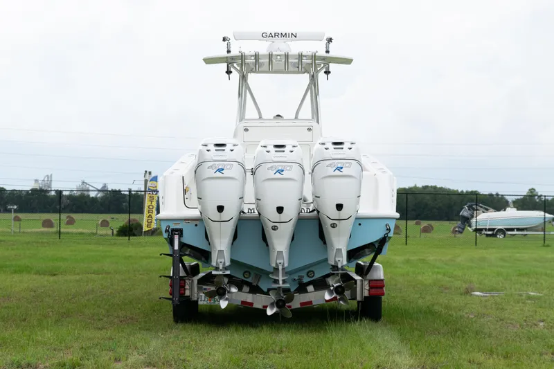  Yacht Photos Pics 2017 SeaVee 340Z boat with triple outboard engines on a grassy field.