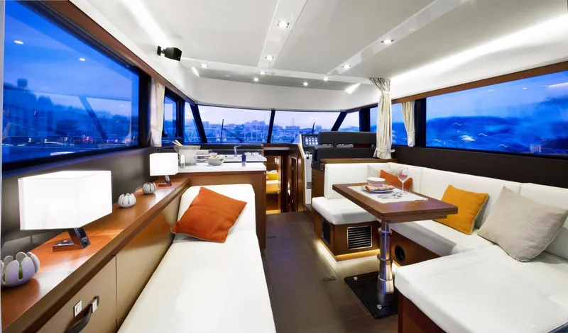  Yacht Photos Pics Manufacturer Provided Image: Luxurious interior of 2017 Jeanneau Velasco 43 yacht with modern furnishings and panoramic windows.