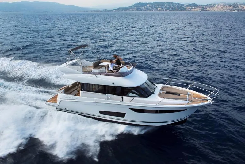  Yacht Photos Pics Manufacturer Provided Image: 2017 Jeanneau Velasco 43 motor yacht cruising on open water.