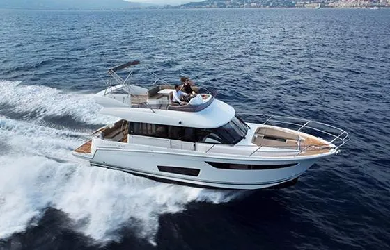  Yacht Photos Pics Manufacturer Provided Image: 2017 Jeanneau Velasco 43 motor yacht cruising on open water.