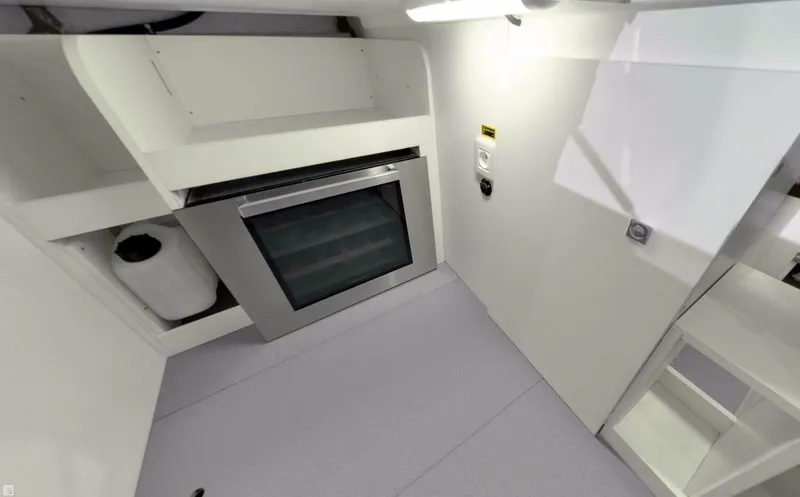  Yacht Photos Pics Manufacturer Provided Image: 2017 Jeanneau Velasco 43 yacht interior kitchen with modern oven and storage.